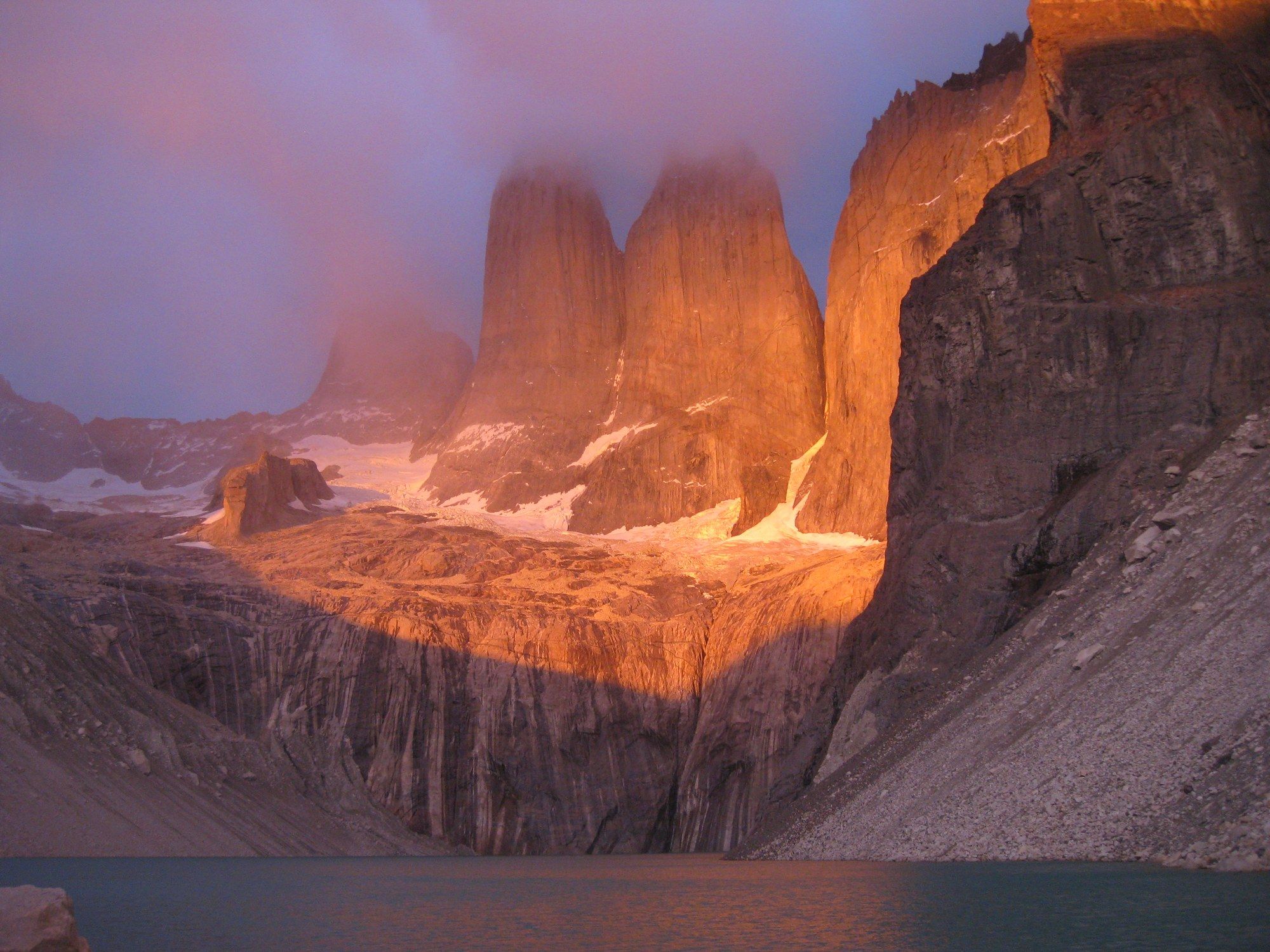 The towers of Torres del Paine lit red by alpenglow
