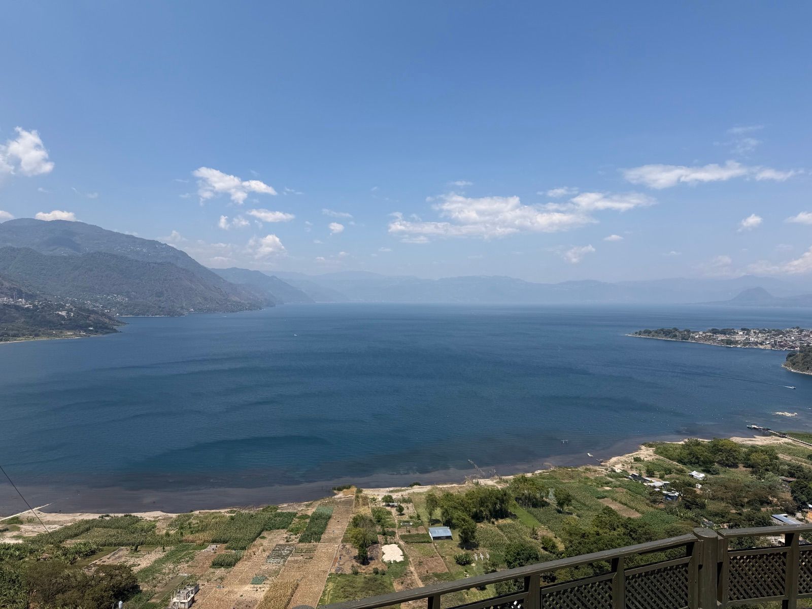 Lake Atitlan from a high overlook with farms and mountains