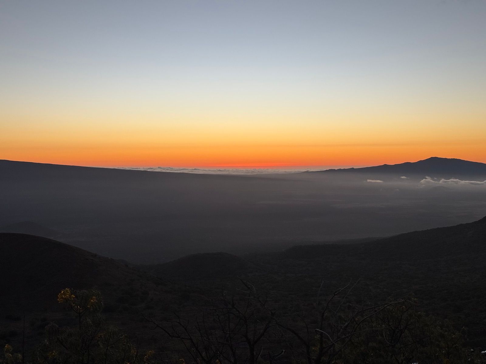 Cloud inversion and a distant peak after sunset