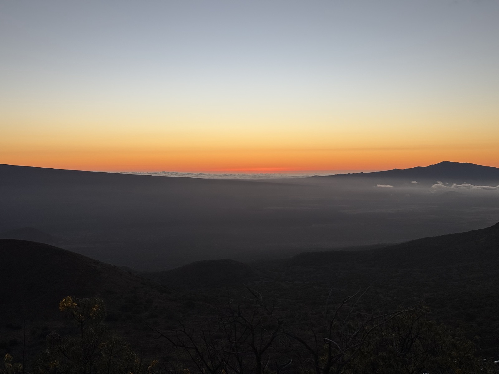 Cloud inversion and a distant peak after sunset